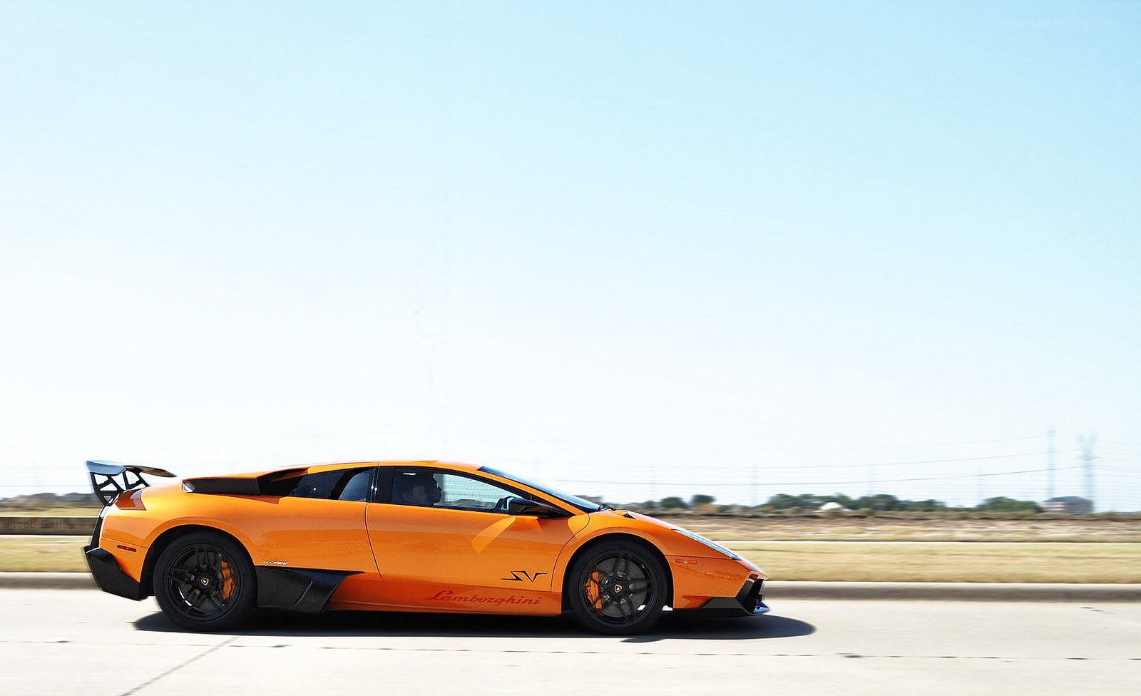 orange Lamborghini on a road