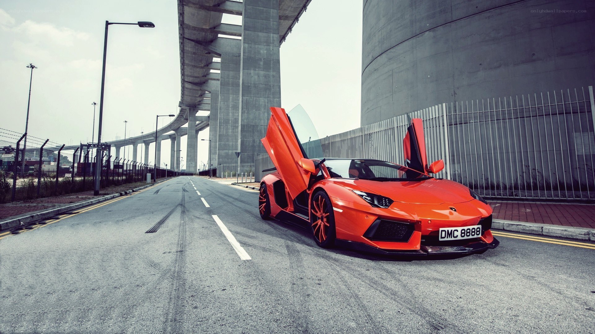 orange Lamborghini on a road