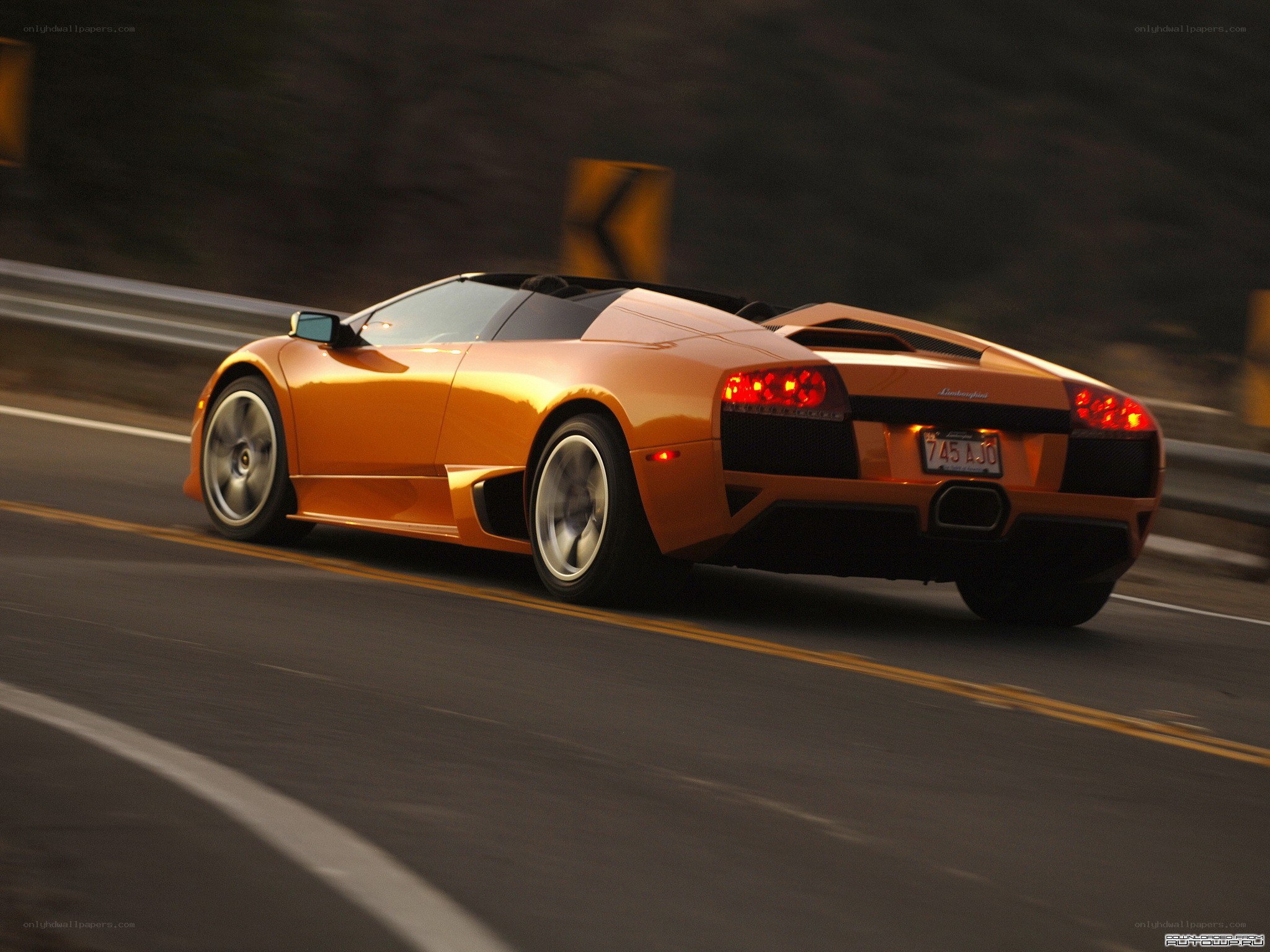 Orange Lamborghini on a road