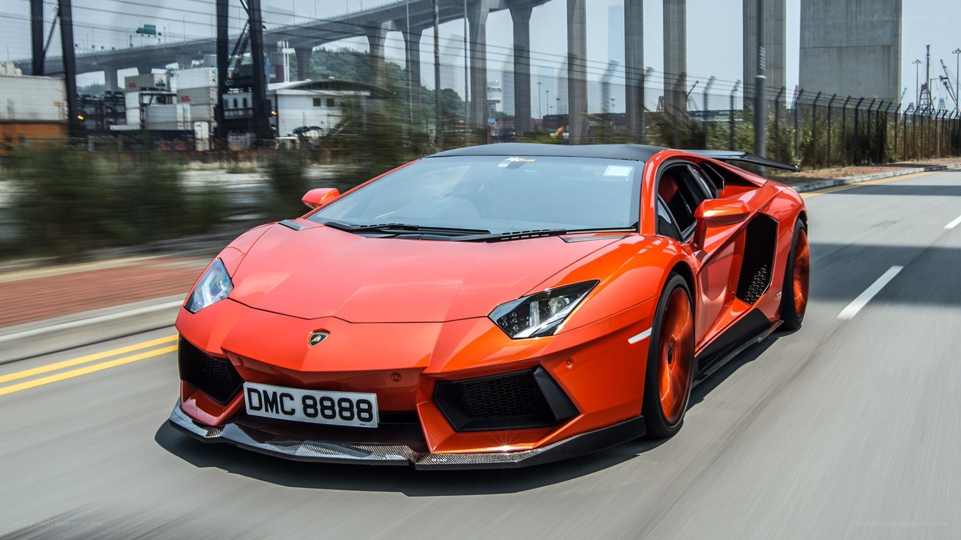 orange Lamborghini on a road