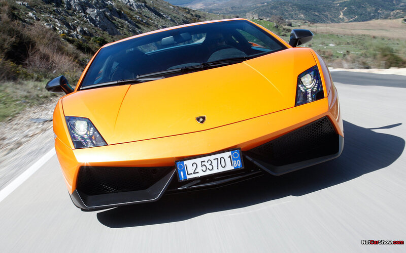 orange Lamborghini on a road