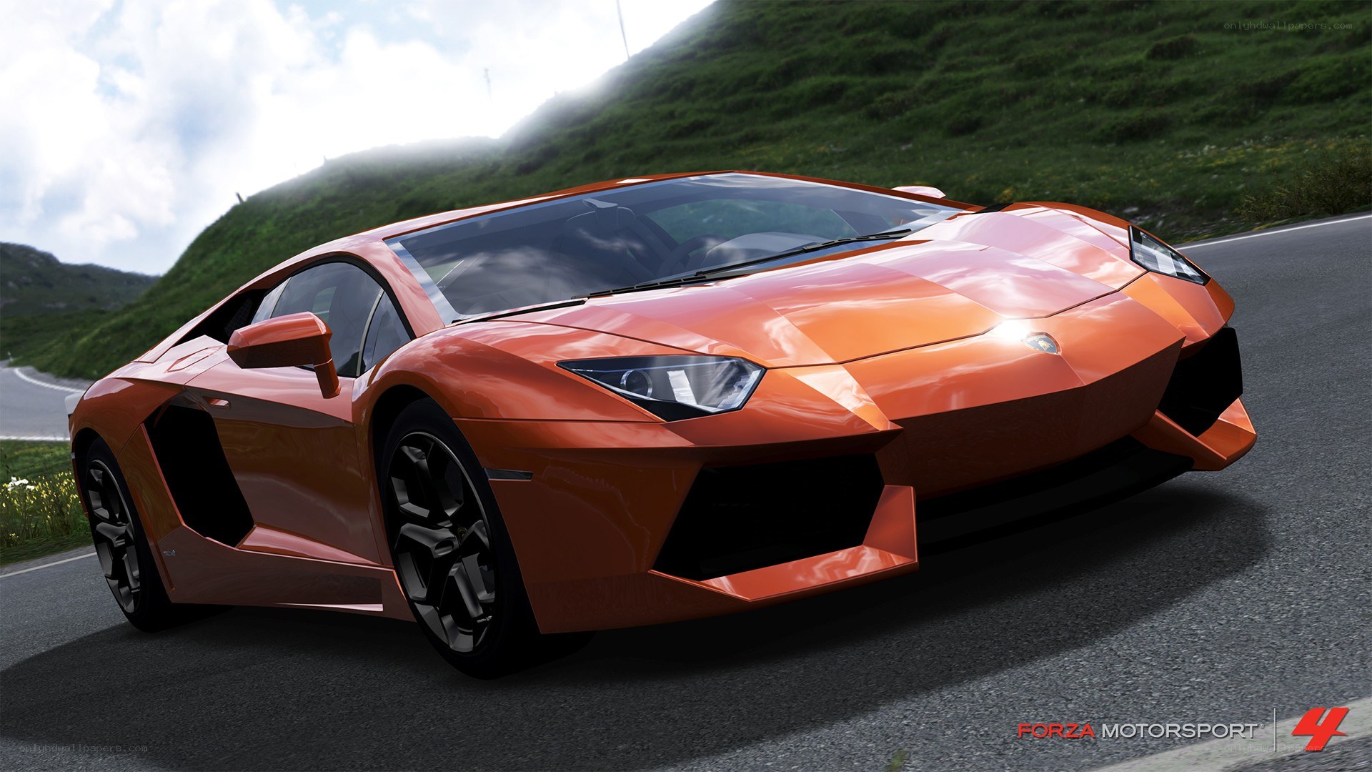 Orange Lamborghini on a winding road