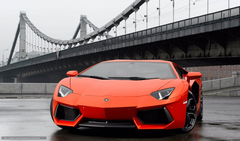 Orange Lamborghini on bridge