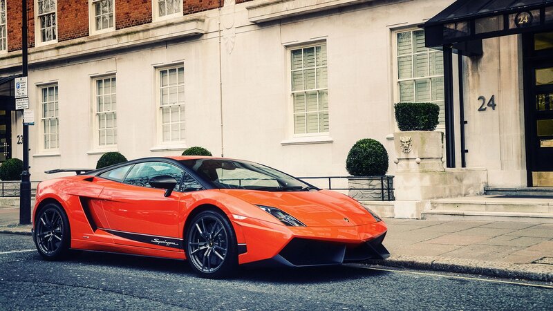Orange Lamborghini on city street