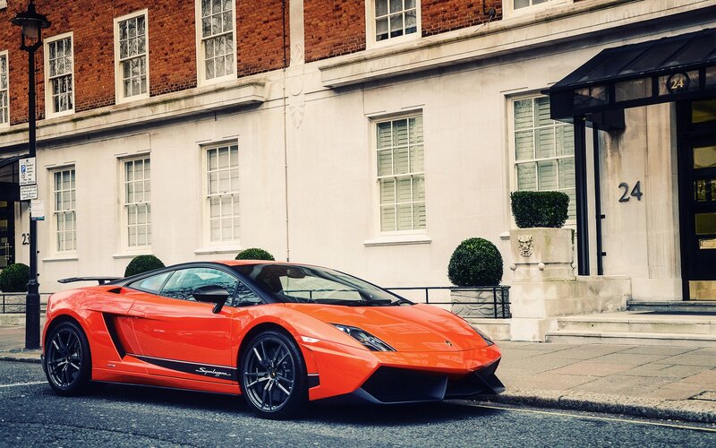Orange Lamborghini on city street