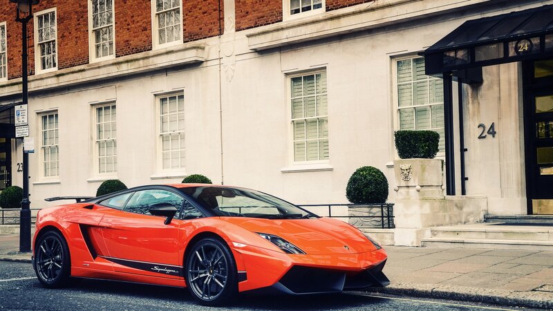 Orange Lamborghini on city street