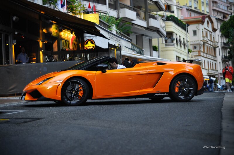 Orange Lamborghini on city street