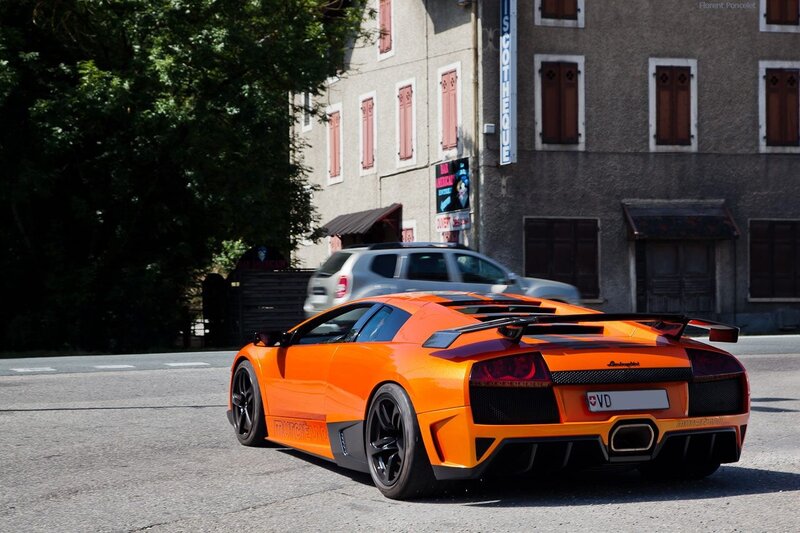 orange Lamborghini on city street