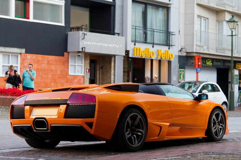 Orange Lamborghini on city street
