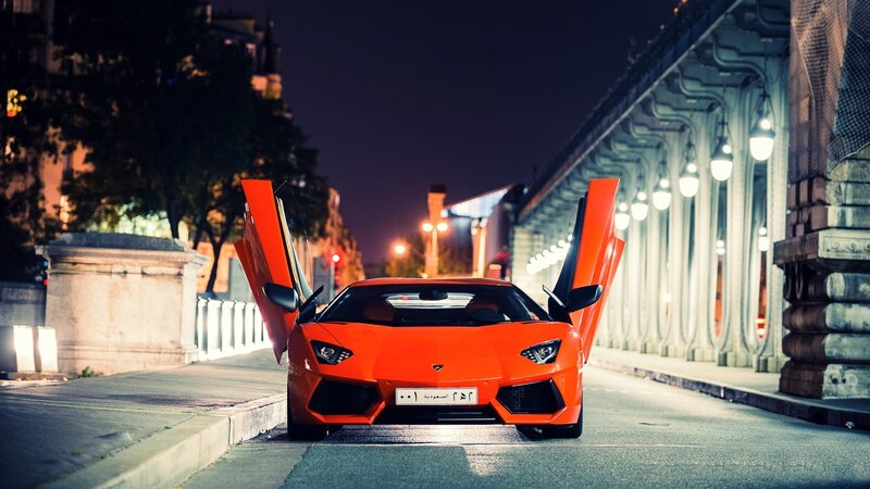 Orange Lamborghini on city street