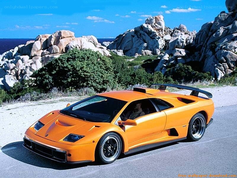 Orange Lamborghini on coastal road