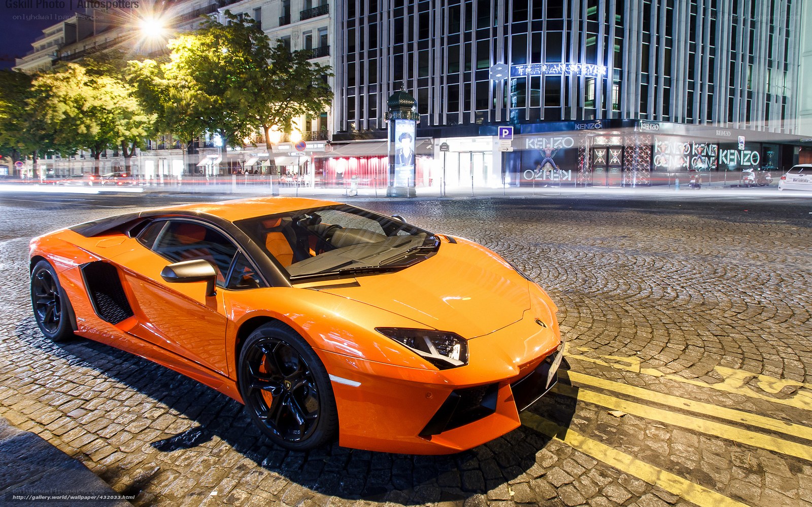 Orange Lamborghini on cobblestone street
