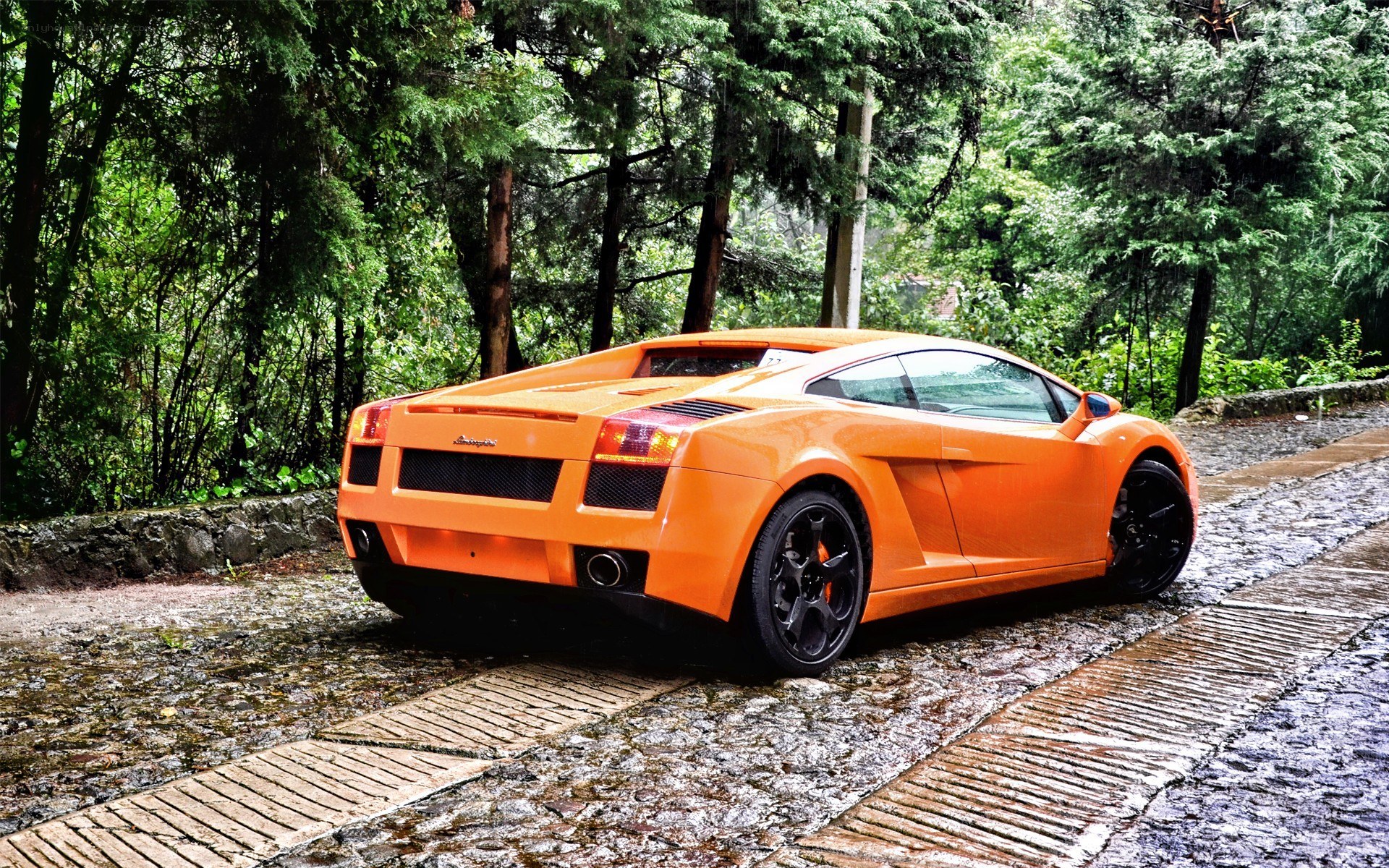 Orange Lamborghini on cobblestone
