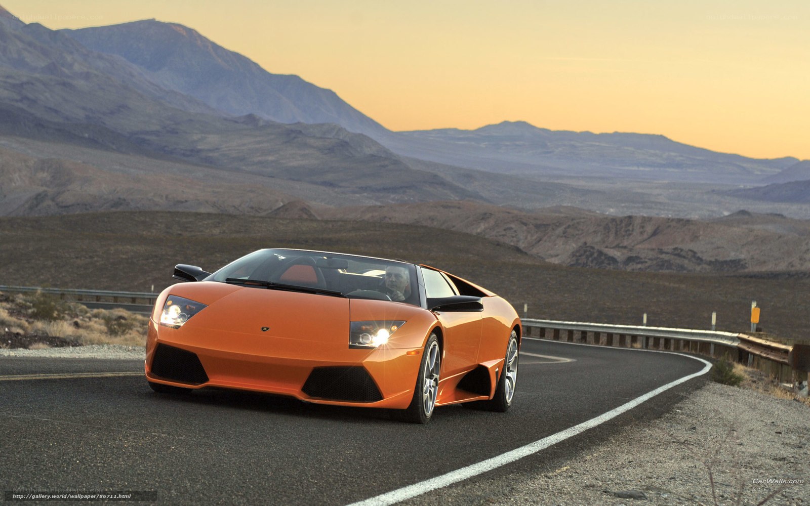 Orange Lamborghini on desert road