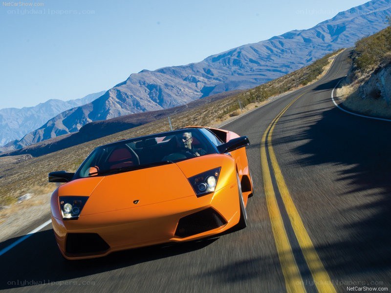 Orange Lamborghini on mountain road