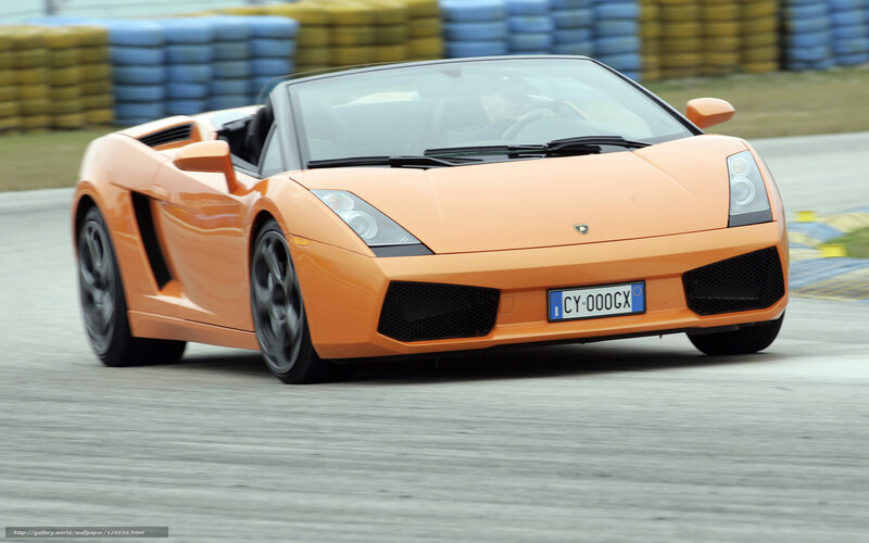 orange Lamborghini on racetrack