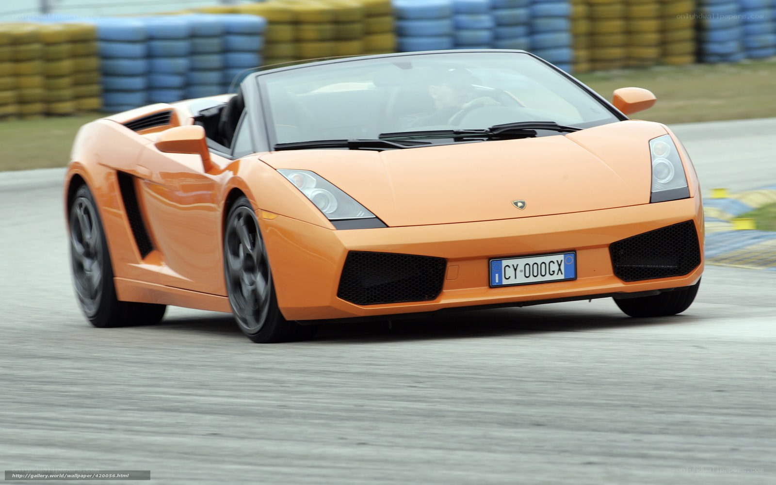 orange Lamborghini on racetrack