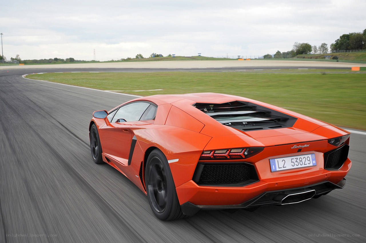 orange Lamborghini on racetrack