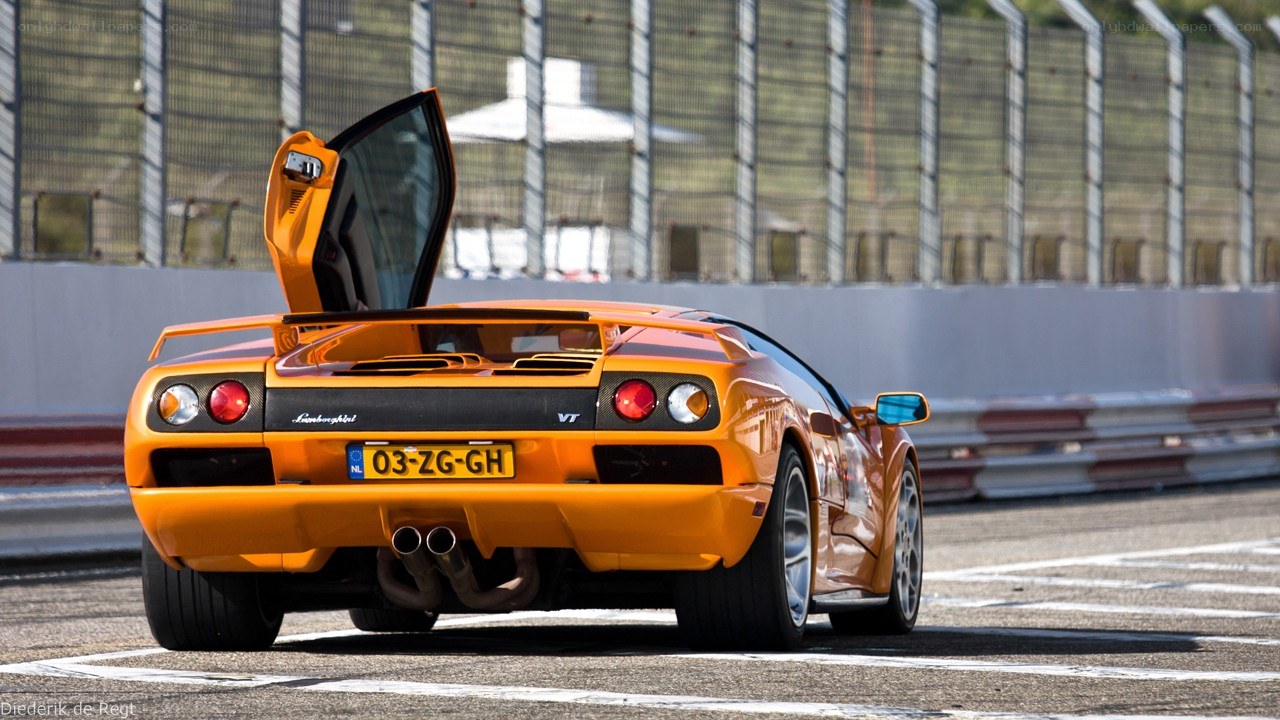 Orange Lamborghini on racetrack
