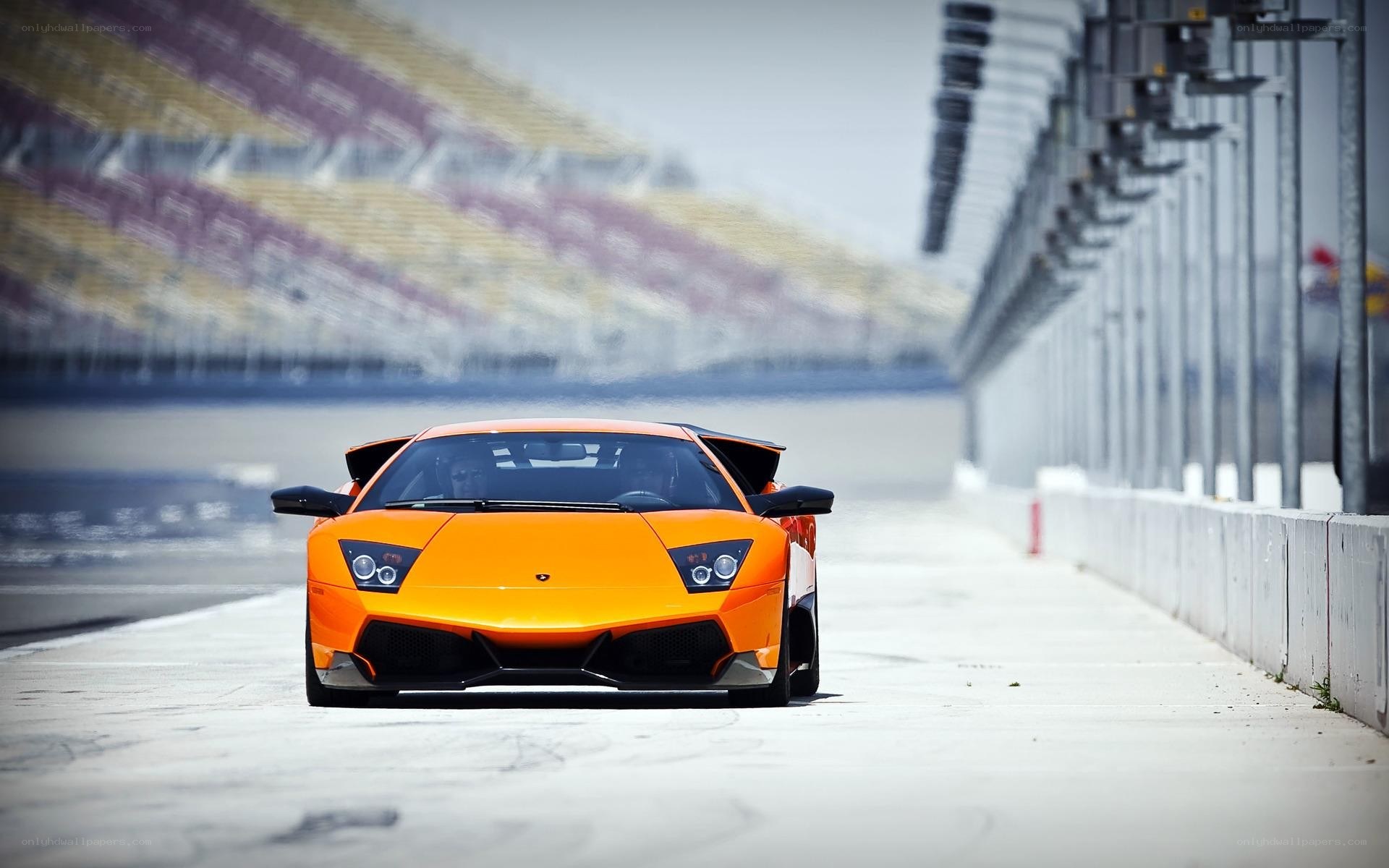 Orange Lamborghini on racetrack