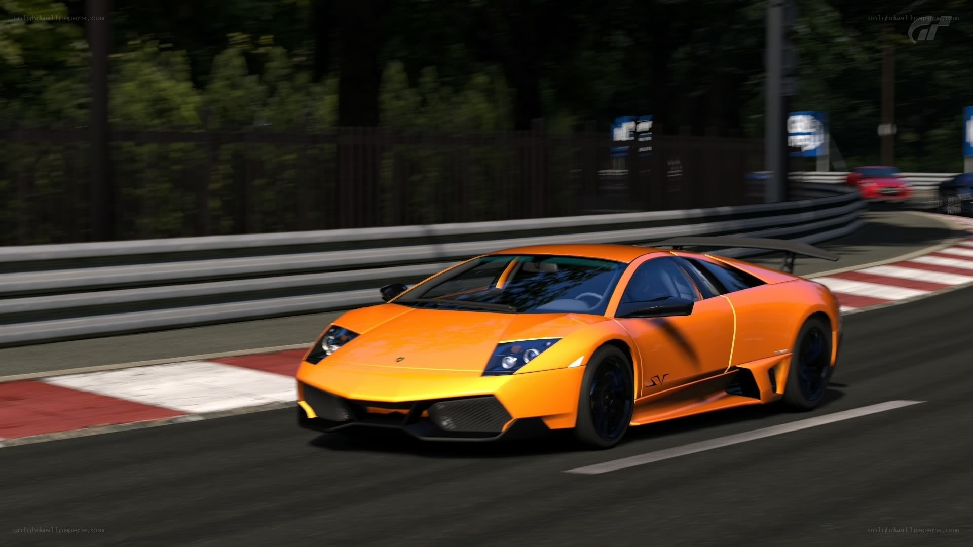 orange lamborghini on racetrack