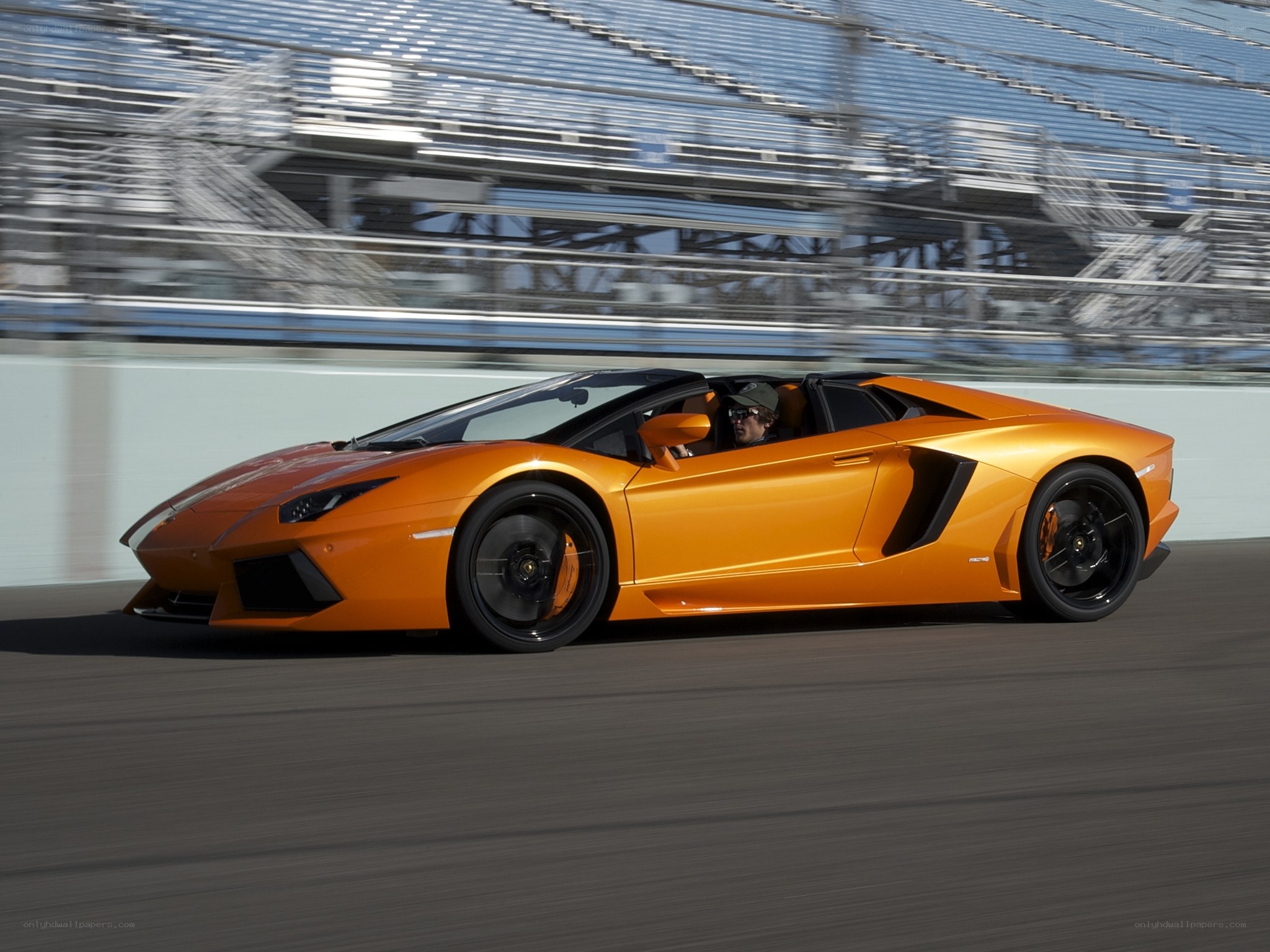 Orange Lamborghini on racetrack