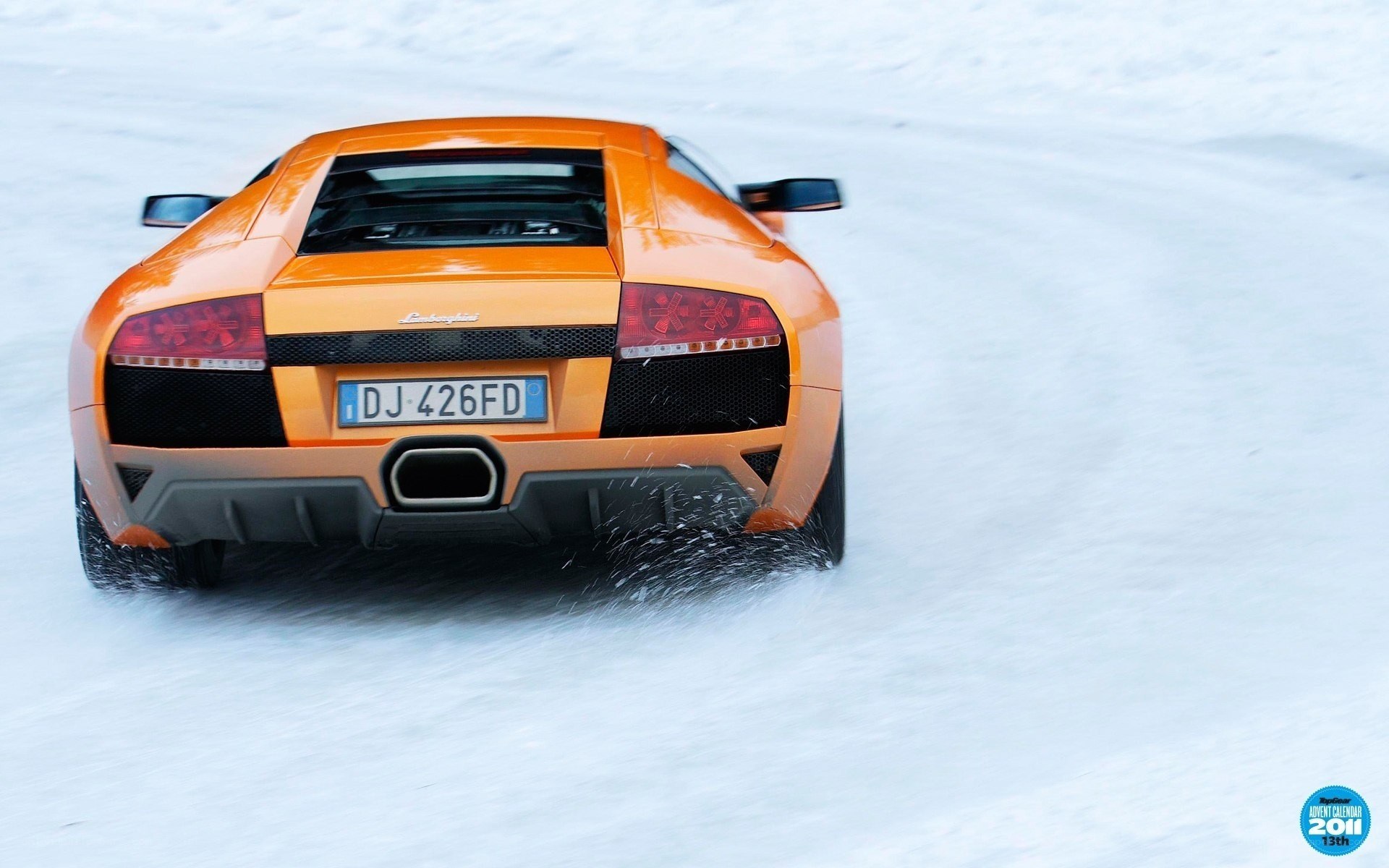 Orange Lamborghini on snow