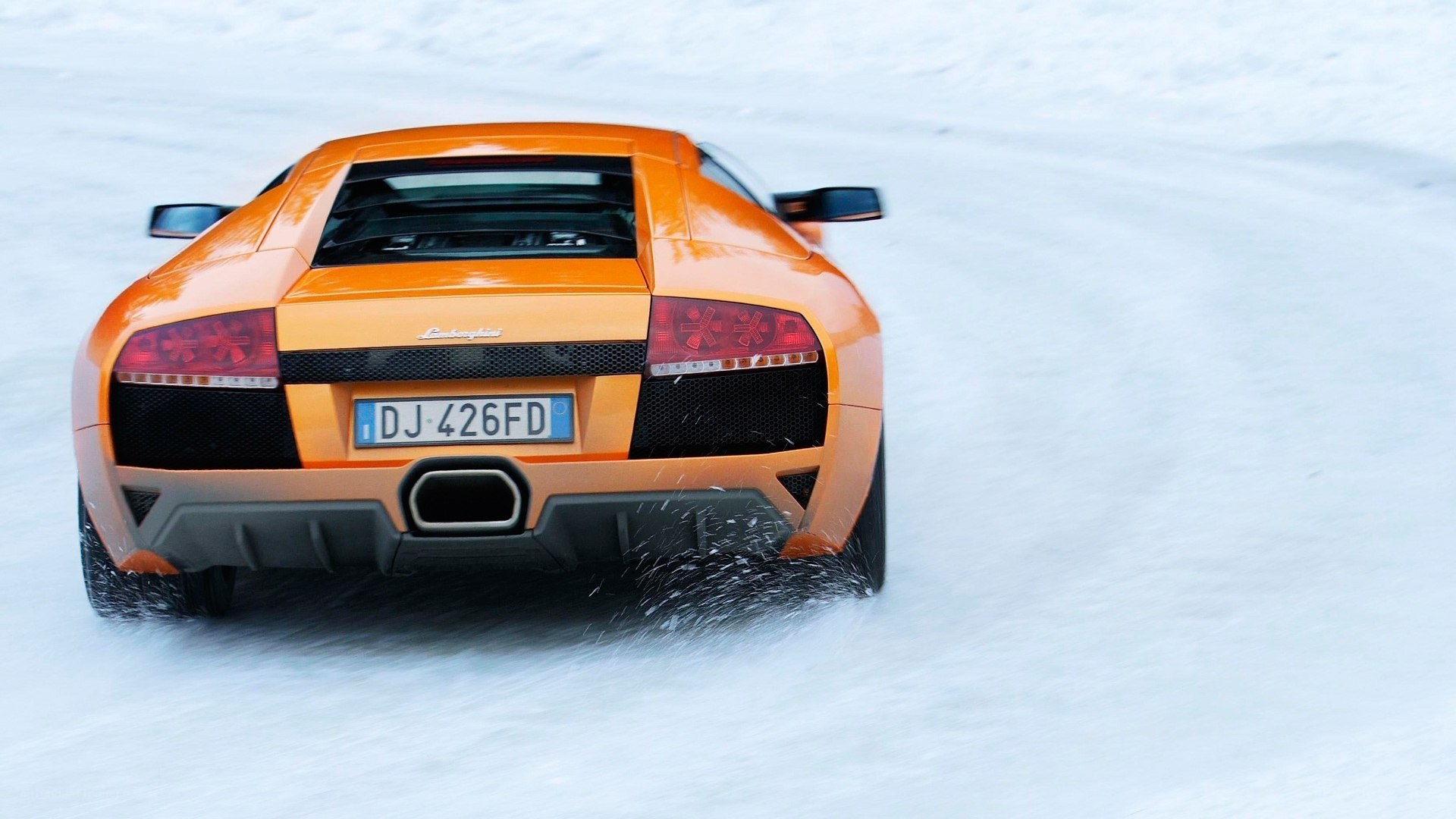 Orange Lamborghini on snow