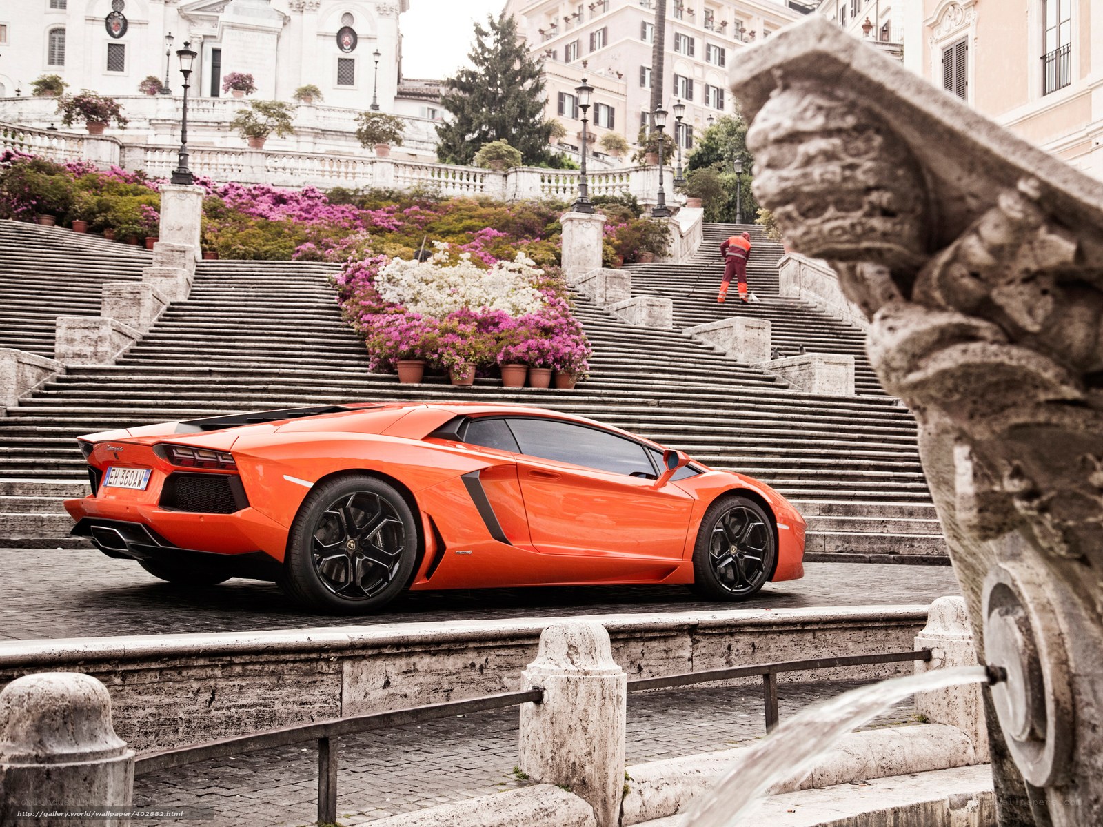 Orange Lamborghini on steps