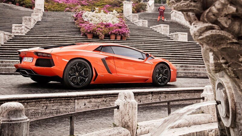 Orange Lamborghini on steps
