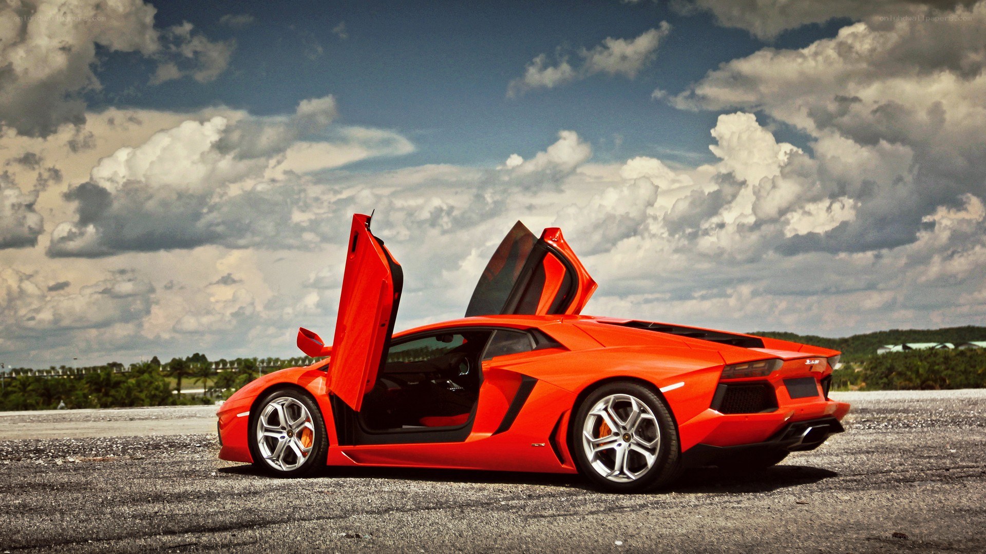 orange Lamborghini on tarmac