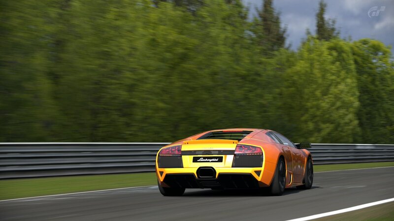 Orange Lamborghini on Track — Dynamic