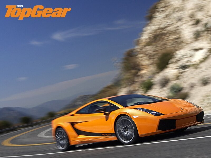 Orange Lamborghini on winding road