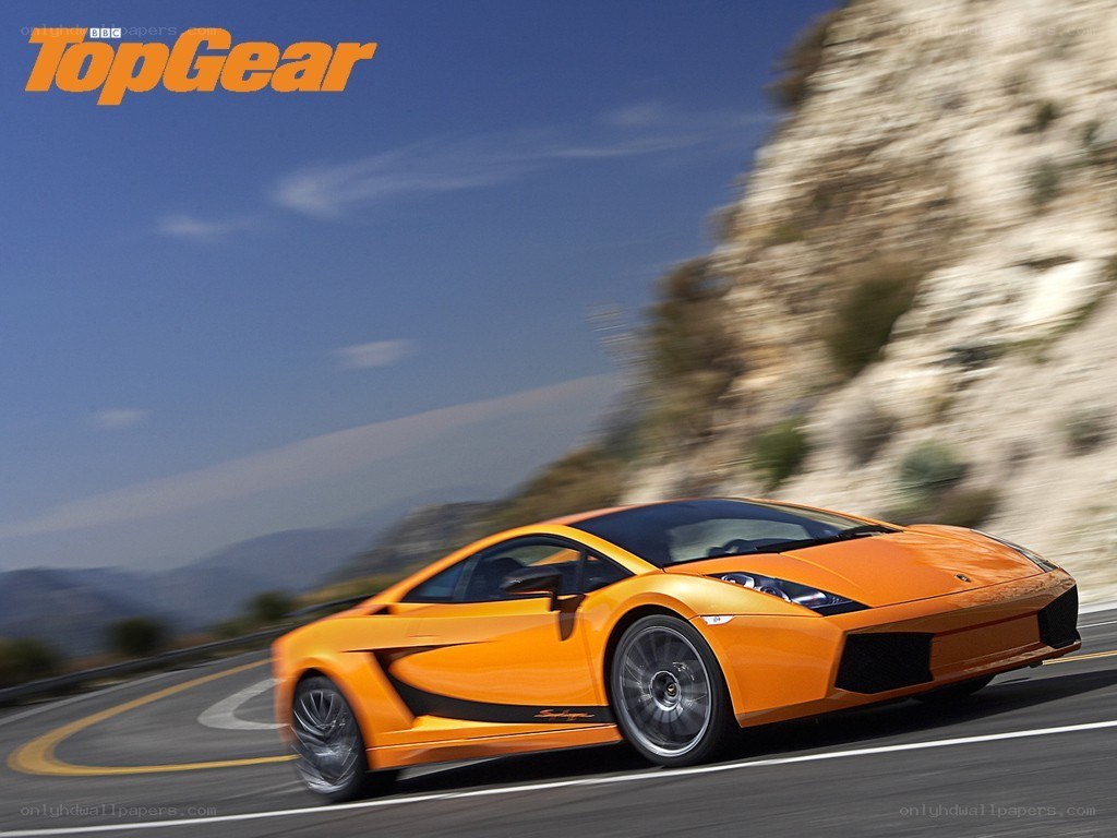 Orange Lamborghini on winding road