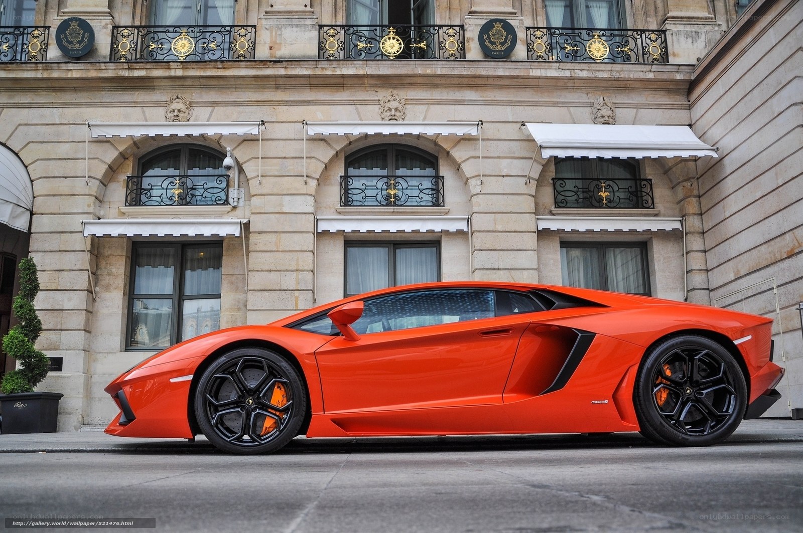 Orange Lamborghini parked in Paris