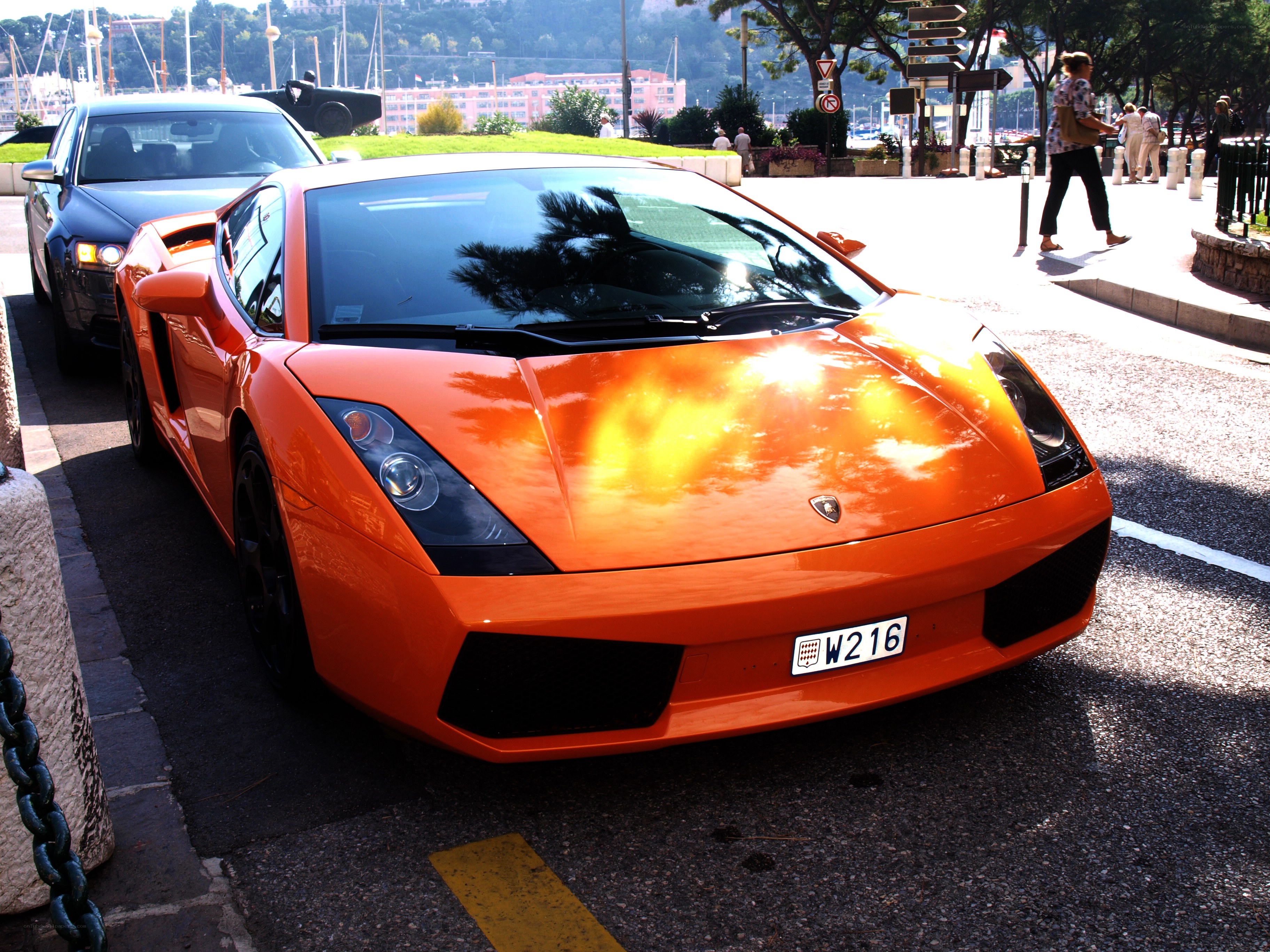 Orange Lamborghini parked on street