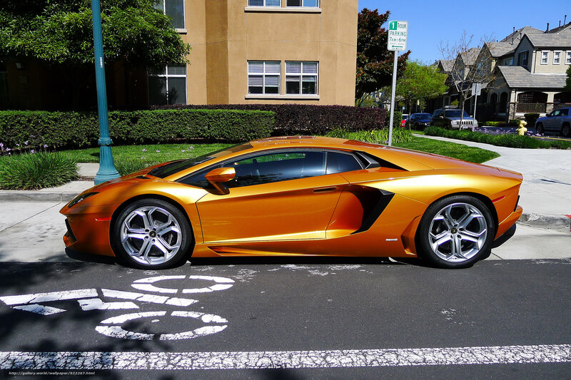 Orange Lamborghini parked on street