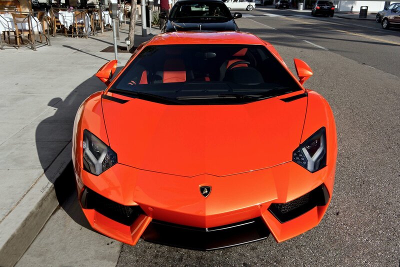 Orange Lamborghini parked on street