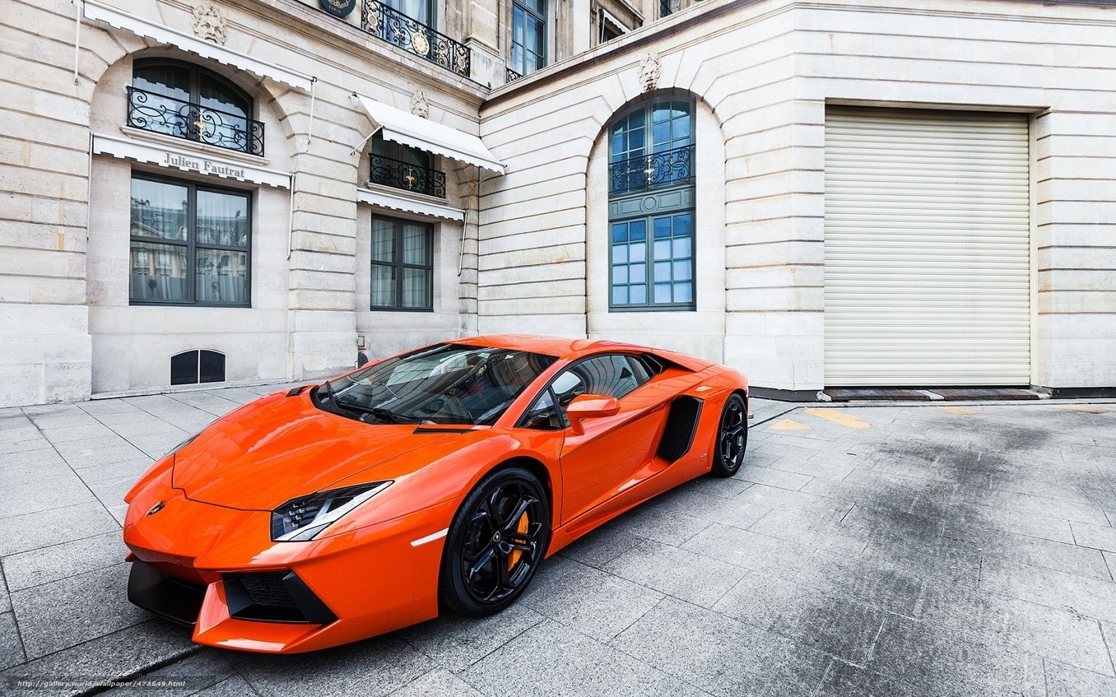 Orange Lamborghini parked on street
