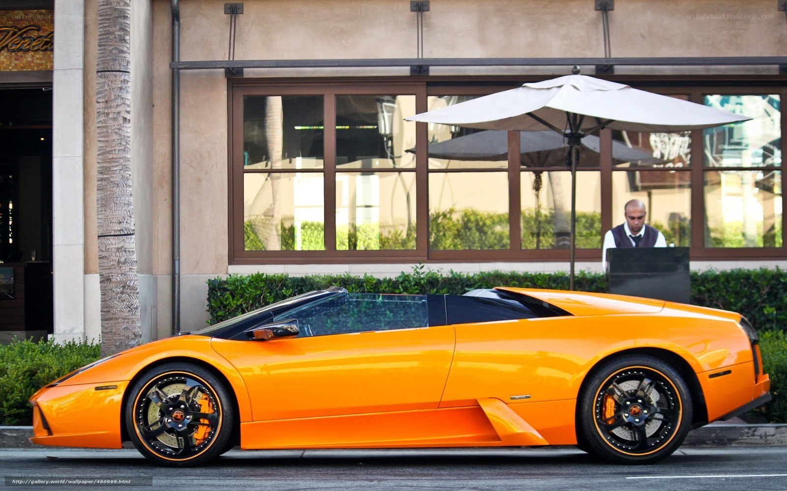 Orange Lamborghini parked outside
