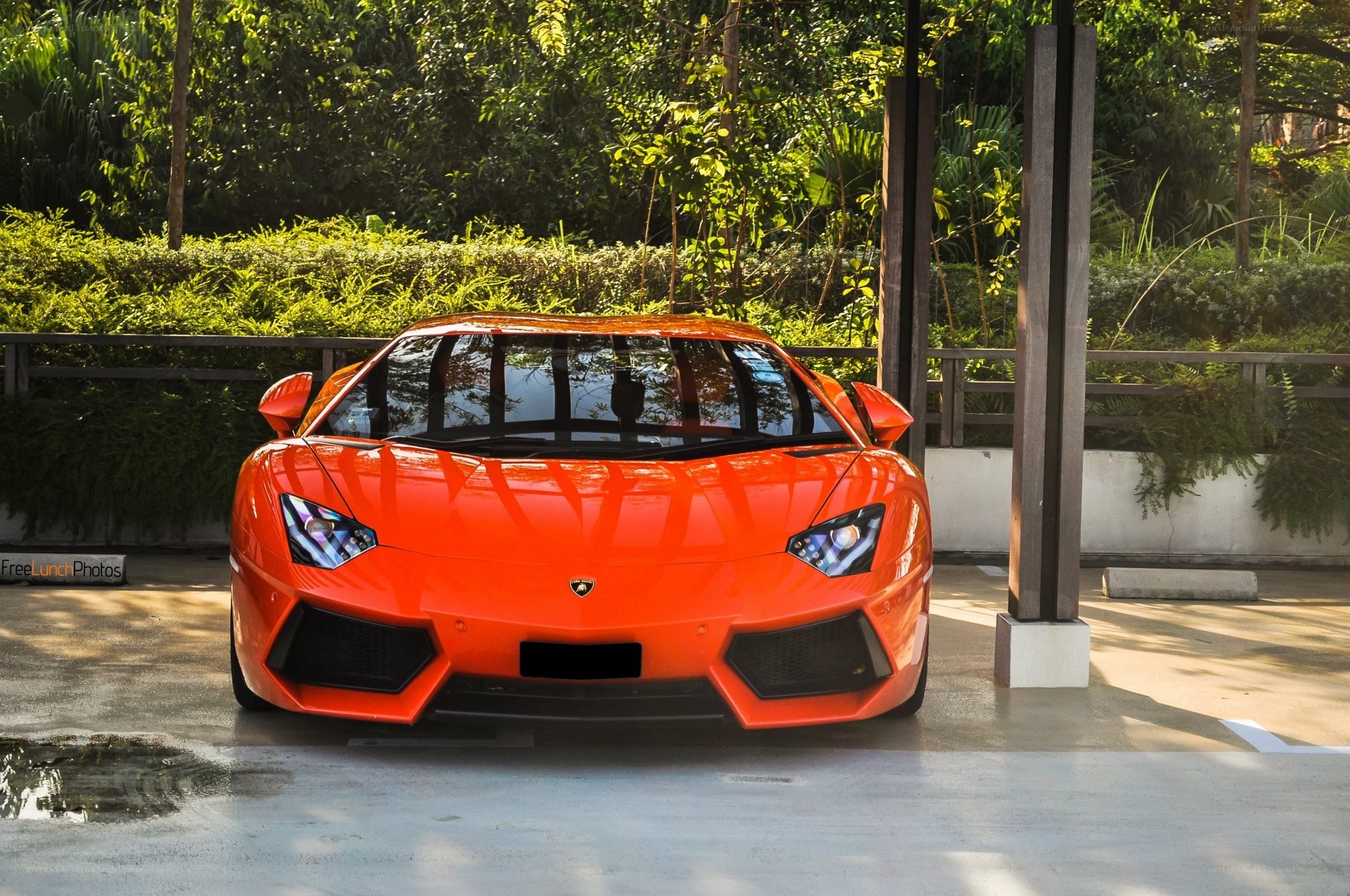 Orange Lamborghini parked outside