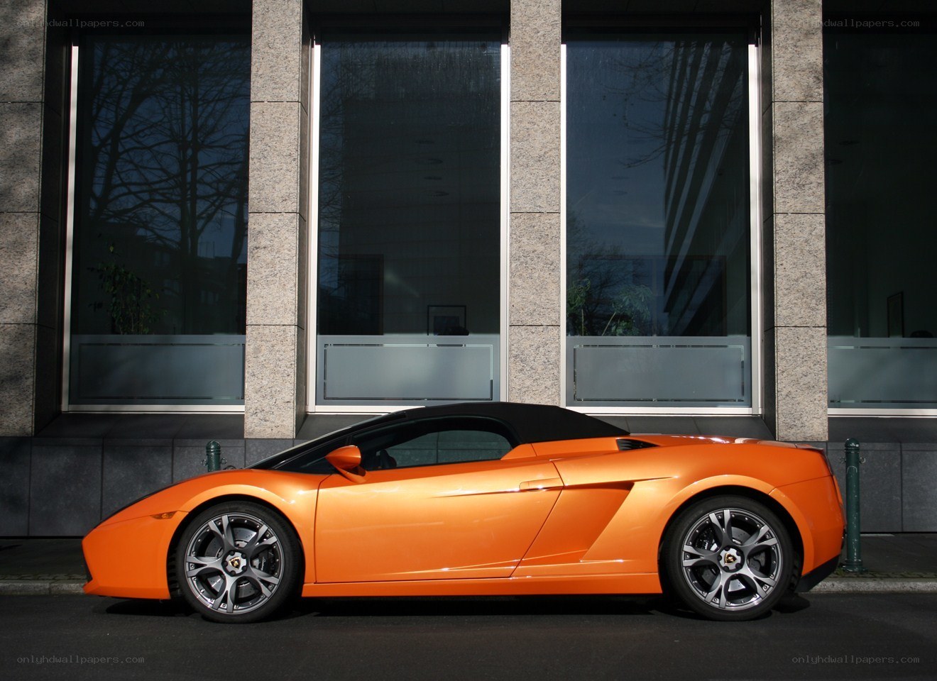 Orange Lamborghini parked outside