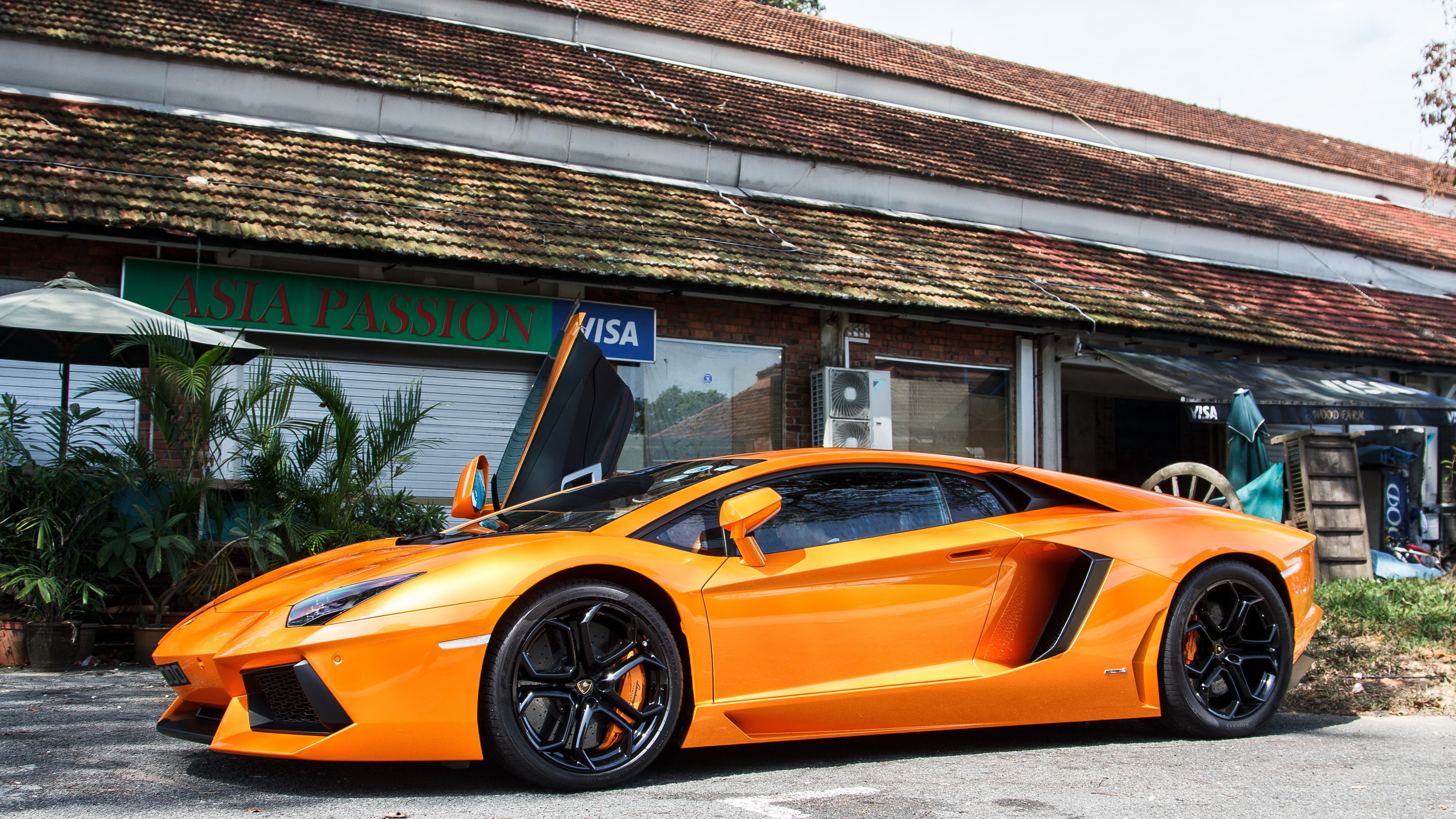 Orange Lamborghini parked outside