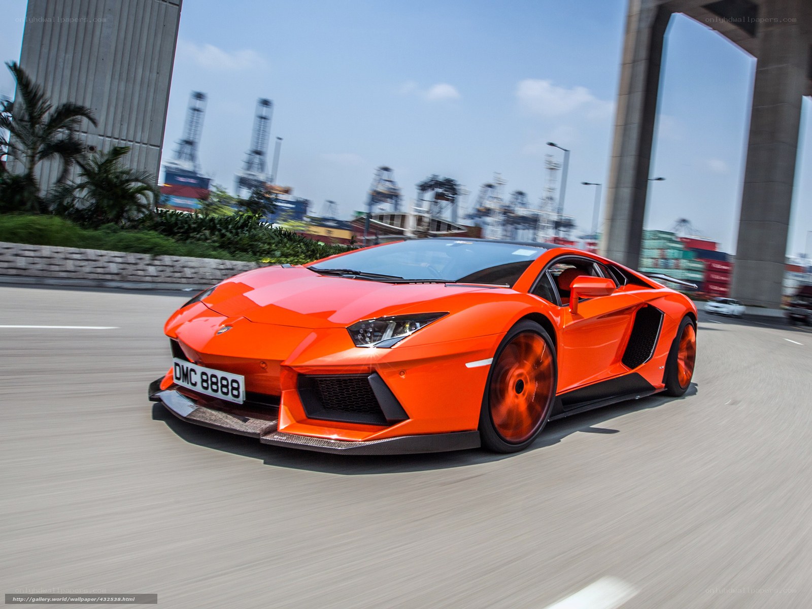 orange Lamborghini speeding on road
