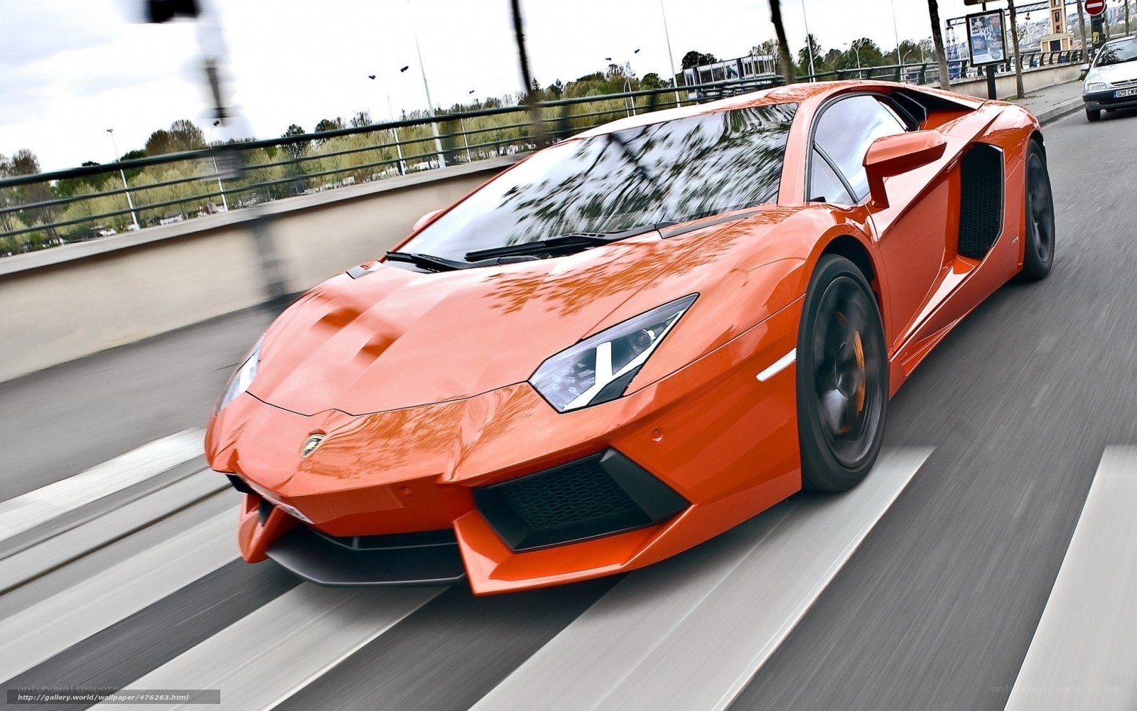 orange Lamborghini speeding on road