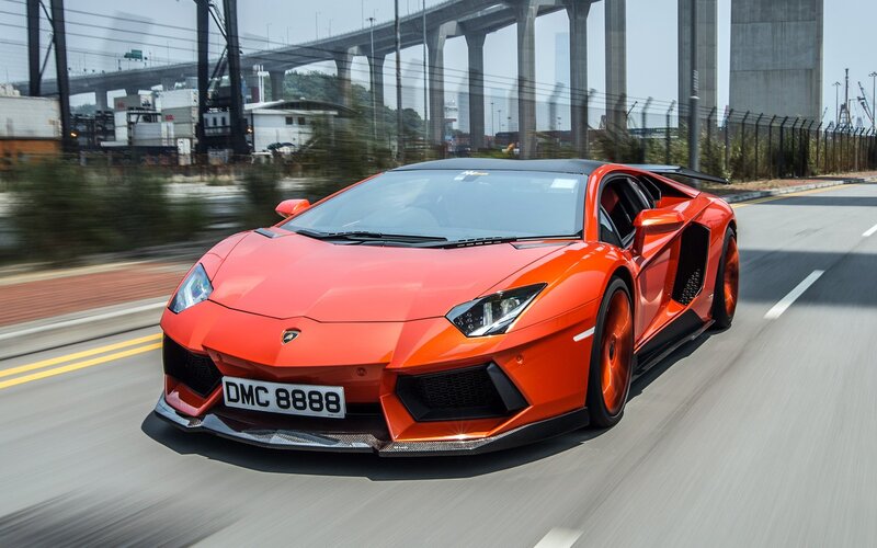 orange Lamborghini speeding on road