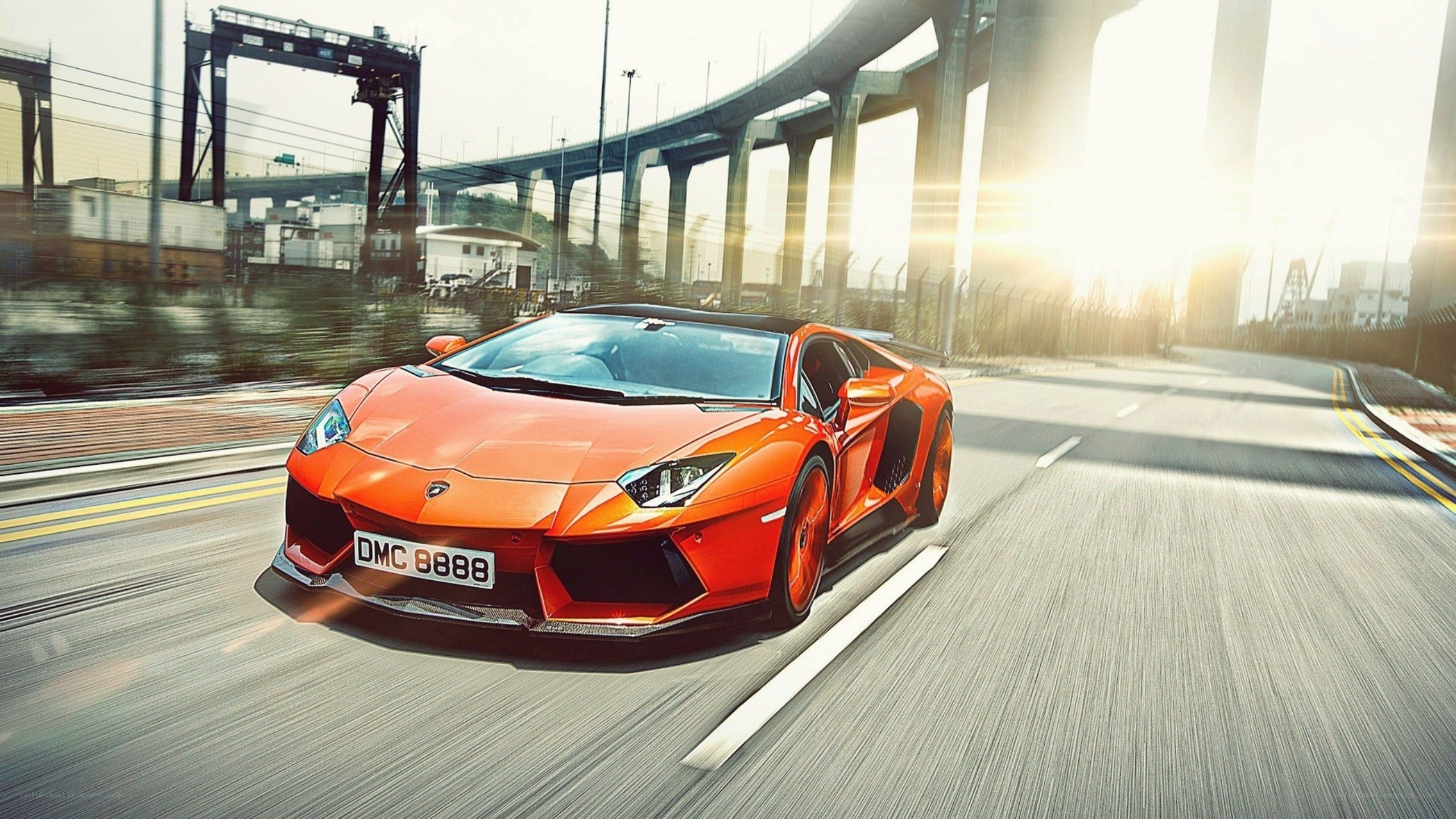 orange Lamborghini speeding on road