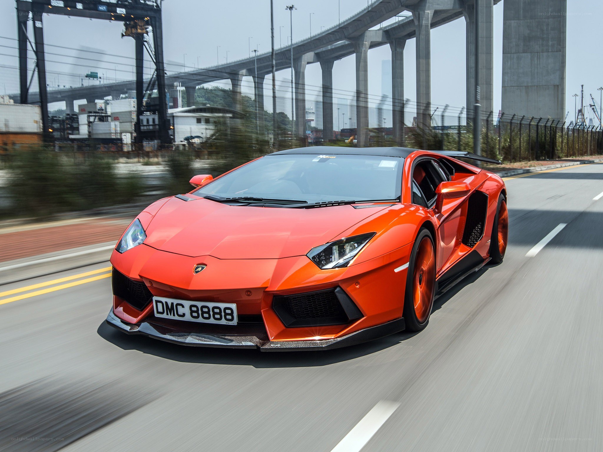 orange Lamborghini speeding on road