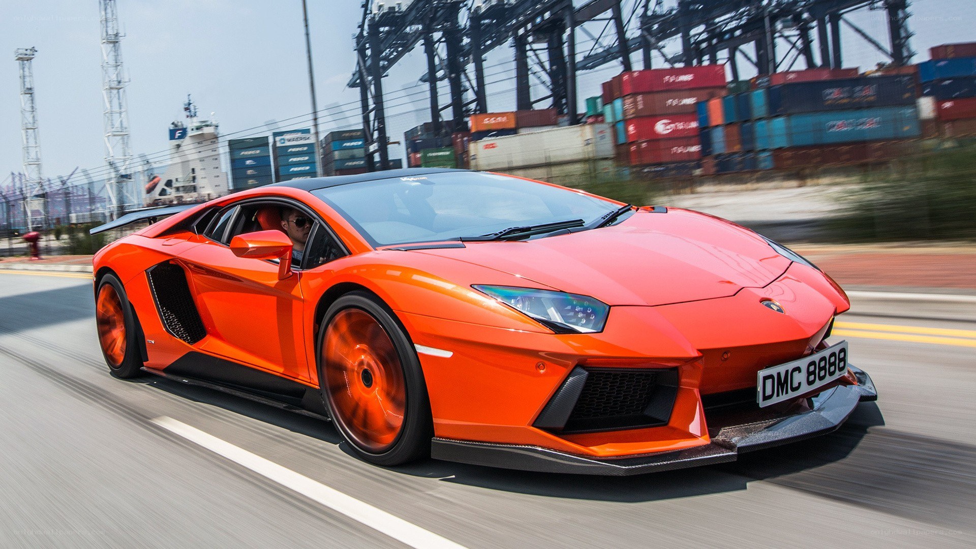 orange Lamborghini speeding on road