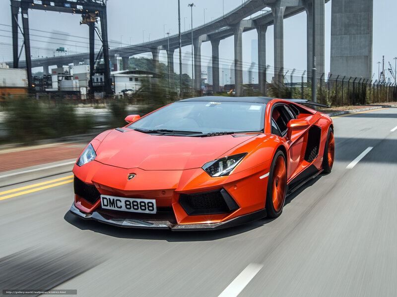 orange Lamborghini speeding on road